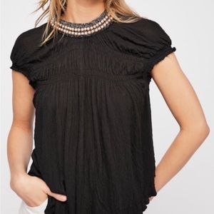 Free people black cap sleeve top size medium with pearl detail. New!!!